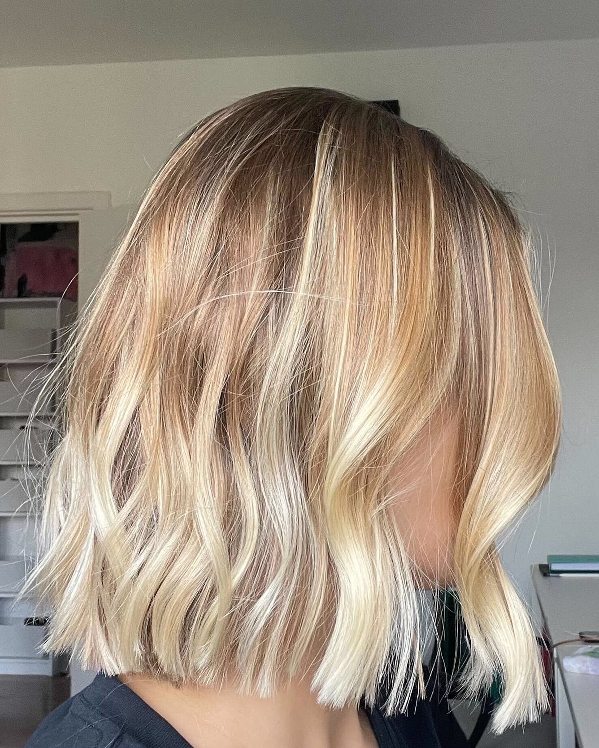 Warm blonde balayage bob styled at Lux Studio in Bow, London