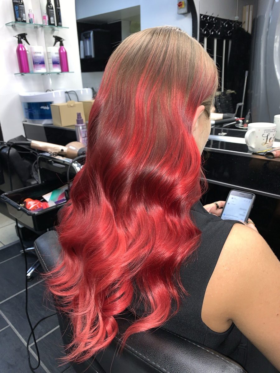 Vivid red ombré on long wavy hair, coloured at Lux Studio Bow
